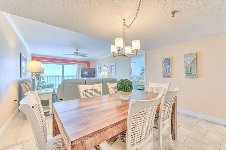 Gather around this beautiful dining table where ocean views frame every meal, creating memories in your coastal retreat.