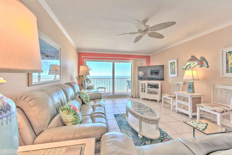Sink into soft leather seating while ocean breezes flow through your bright, coastal living room with stunning sea views.