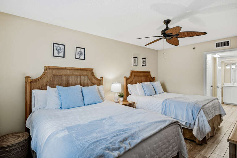 Rest peacefully in your twin beds with tropical wicker headboards and crisp linens under the gentle breeze of your ceiling fan.