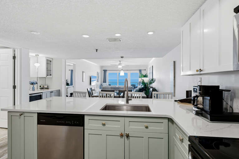 Your spacious kitchen flows seamlessly into the dining and living areas, with stunning ocean views as your backdrop while cooking.