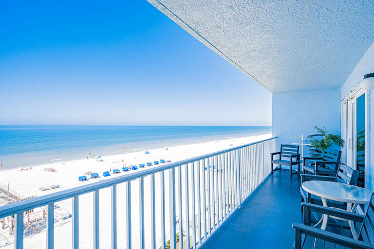 Step onto your private balcony and soak in breathtaking ocean views with pristine beach stretching endlessly below your seaside retreat.