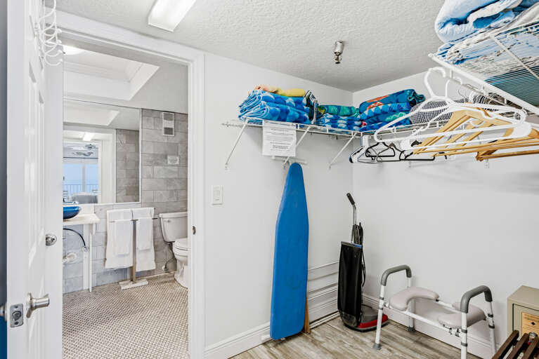 Your walk-in closet offers convenient storage with hangers and shelving, plus easy access to your private bathroom.