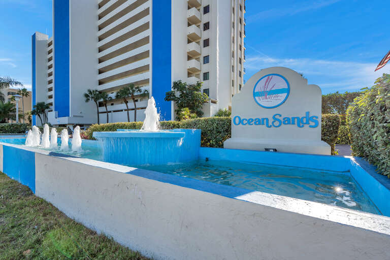 Ocean Sands resort entrance features an elegant fountain display marking your arrival at this beachside destination.