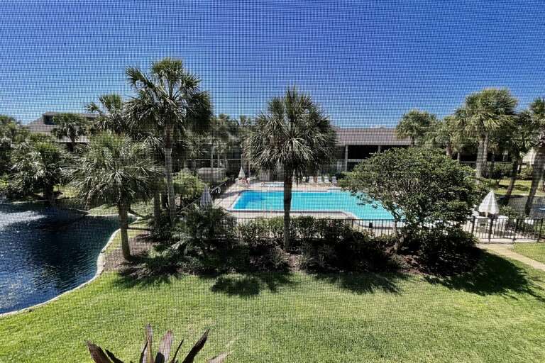 Village Del Lago pool/lagoon view from enclosed lanai