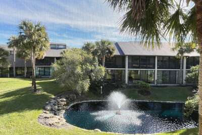 Village Del Prado lagoon view from enclosed lanai