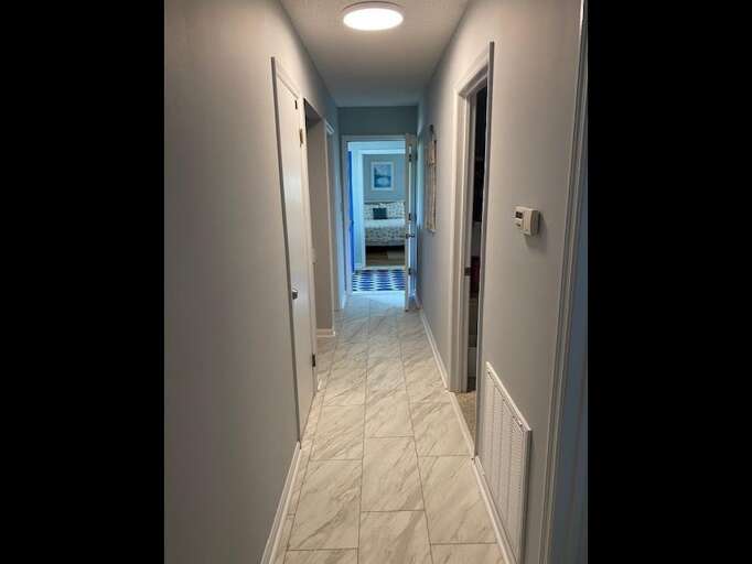 Hallway to Bedrooms on bottom floor Hallway to Bedrooms on bottom floor