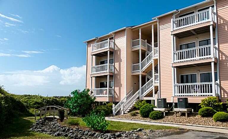 Back of building with walkway to oceanside Back of building with walkway to oceanside