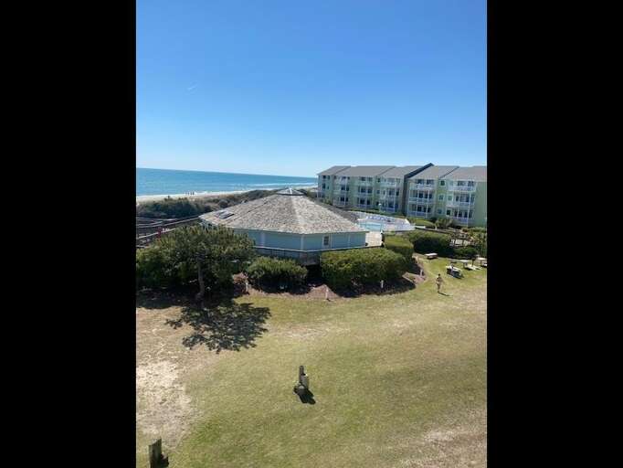 view of clubhouse and grill area from deck view of clubhouse and grill area from deck