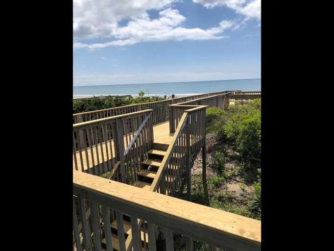 walkway to beach, dune deck and ground level with grill and outside shower walkway to beach, dune deck and ground level with grill and outside shower
