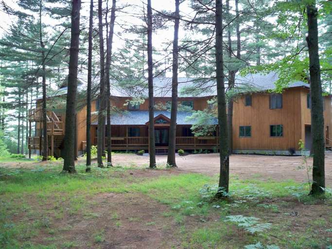 Wooden House In A Forest Clearing Wooden House In A Forest Clearing