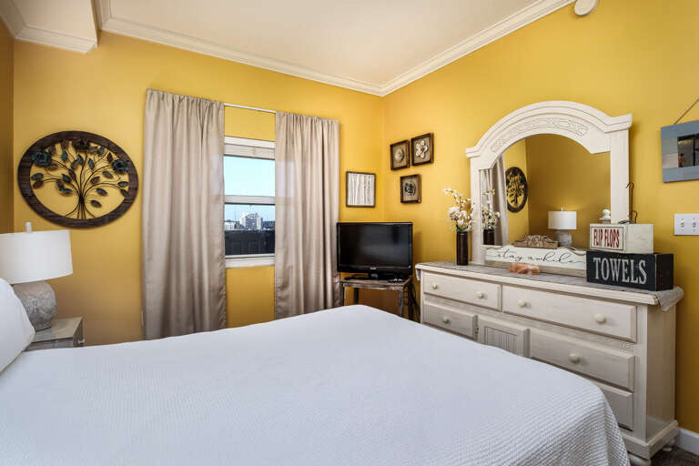 This bedroom has a TV & a window for more sunlight. This bedroom has a TV & a window for more sunlight.