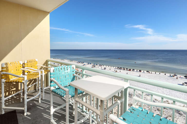 Several pub height balcony chairs and a table to enjoy an afternoon drink while marveling at the sunsets. Several pub height balcony chairs and a table to enjoy an afternoon drink while marveling at the sunsets.