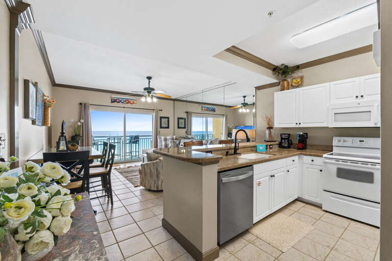 Alternate view of the fully stocked kitchen. All appliances, cookware, and utensils for basic cooking needs. 