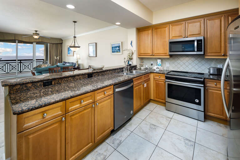 Captivating fully equipped kitchen complete with stainless steel appliances Captivating fully equipped kitchen complete with stainless steel appliances