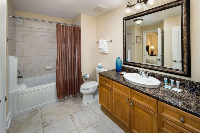 Spacious shower, tiled floors, and private entrance to the second guest bedroom Spacious shower, tiled floors, and private entrance to the second guest bedroom