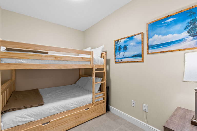 Fullsize bunk over full with a trundle!  The bunk room is directly across from guest bathroom 1