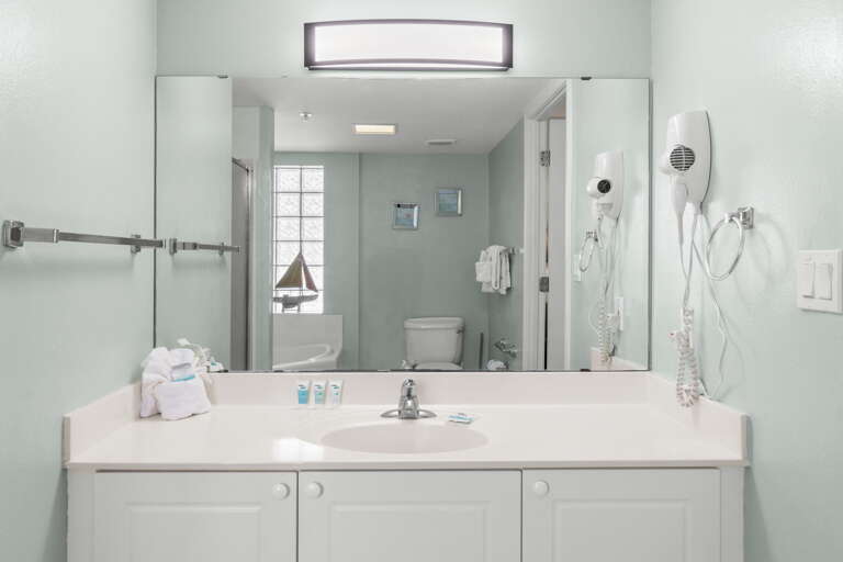 Nice vanity with lots of storage and a large mirror so you can boast in your perfect tan.