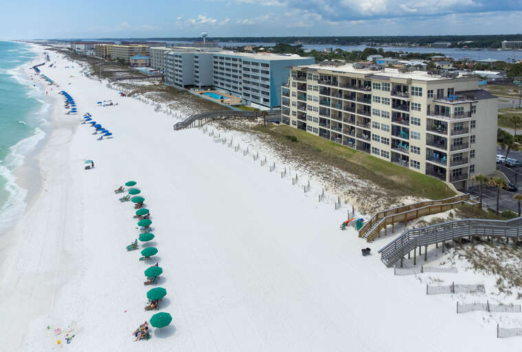 See those beach chairs and umbrellas? One set comes with the rental DAILY during season. Compliments of Brooks and Shorey Resorts!