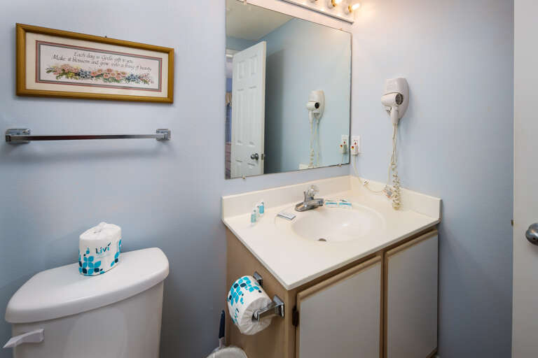 The hall bath can be used by guests of the 2nd bedroom, but can also be accessed from the kitchen area.