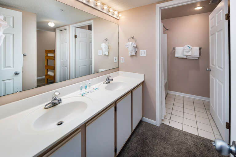 Double sinks and access to a shower and tub combination. Double sinks and access to a shower and tub combination.