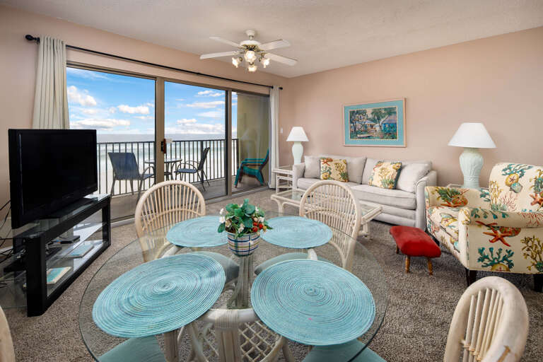 Enjoy this colorful & spacious living room with plenty of seats for everyone!