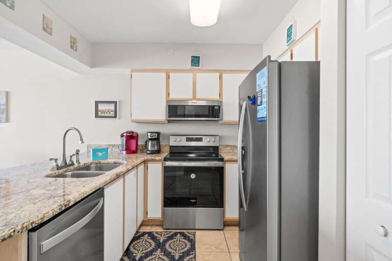 Make your favorite meals in this well stocked kitchen.  The countertops are granite & there is lots of cabinet space. 