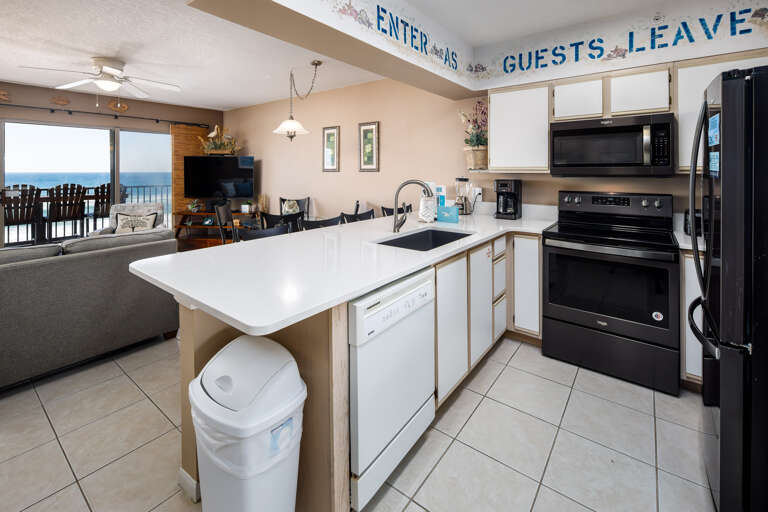 "ENTER as Guests, Leave as Friends" The kitchen island offers a perfect space for a quick sandwich, while the rest of the kitchen is equipped with all major appliances to make a healthy home cooked meal.