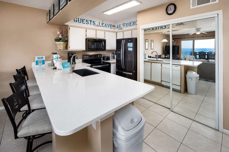 BEAUTIFUL Gulf Front kitchen equipped with all the necessities. Including additional seating at the island.