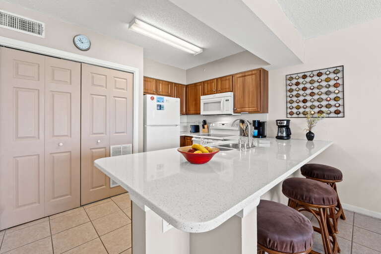 Seating for 3 more guests at the kitchen island.