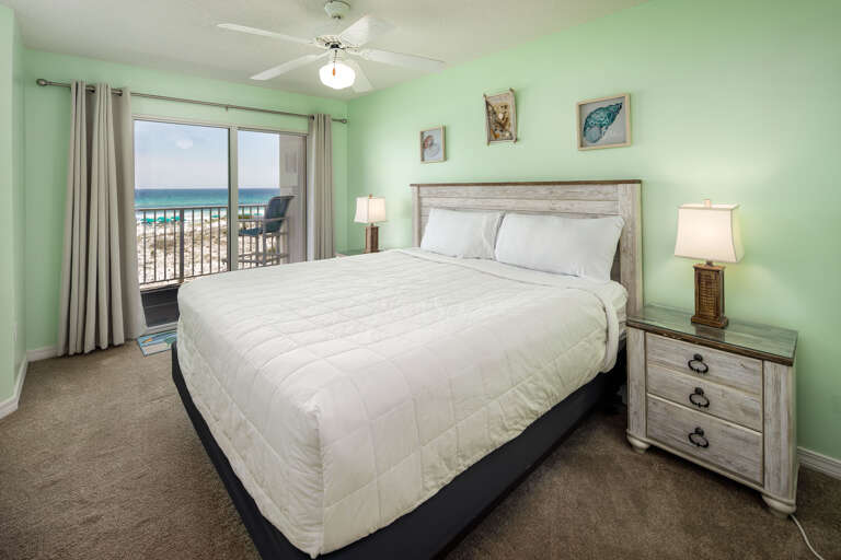The luxury continues into the master bedroom with its king size bed, balcony access and flat screen TV.