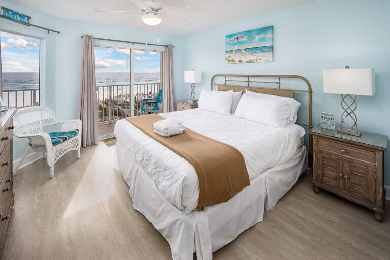  Master bedroom with lots of windows and entry to the beach front balcony