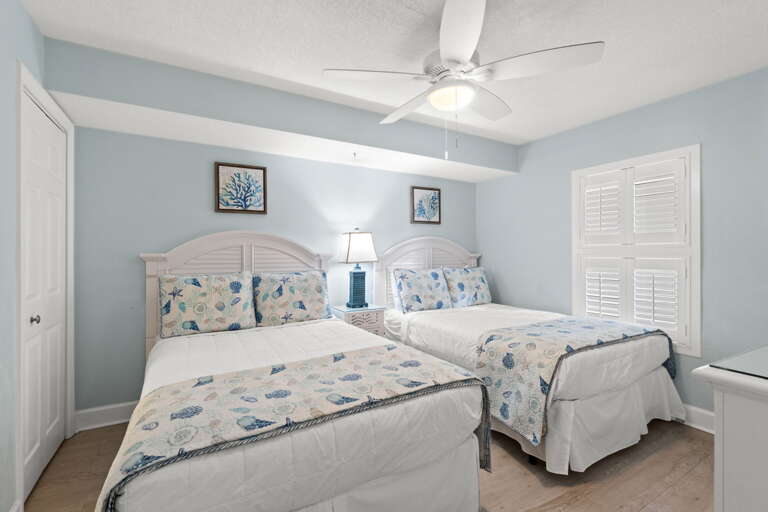 Full size beds and another flat screen TV in the third bedroom
