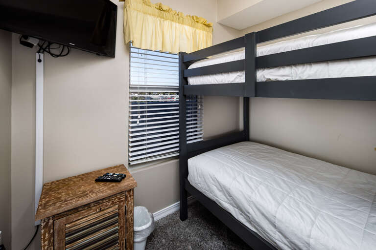 An additional bunk-room gives the little ones a place of their own to relax and unwind after a day of fun in the sun.
