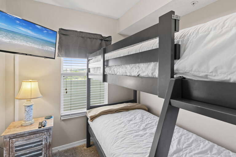 An additional bunk-room gives the little ones a place of their own to relax and unwind after a day of fun in the sun.