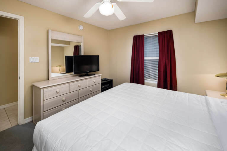 King size bed and flat screen tv in this master bedroom