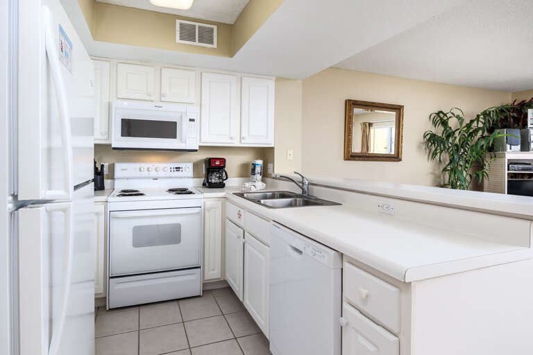 Clean crisp white through out fully equipped kitchen