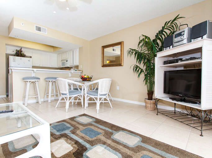 A flat screen television in the living area