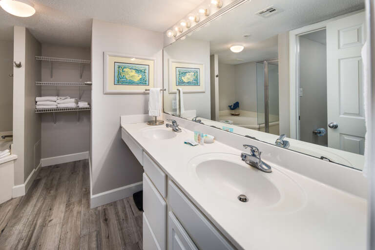 Master bathroom with a large mirror and double vanity; perfect for getting ready for a night out!
