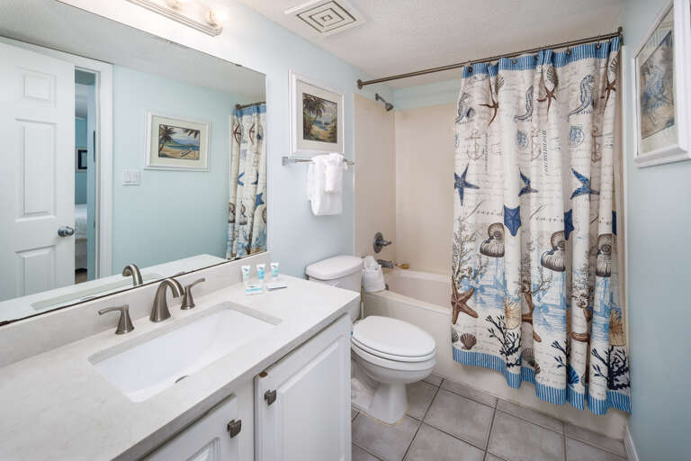 Guest bathroom with nautical themes that run throughout the entire unit.