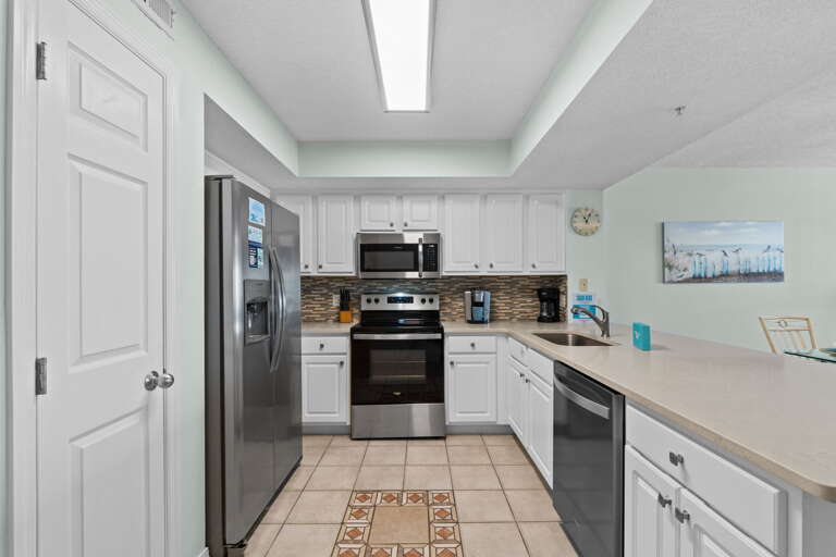 Enjoy cooking in this fully stocked kitchen while enjoying the view