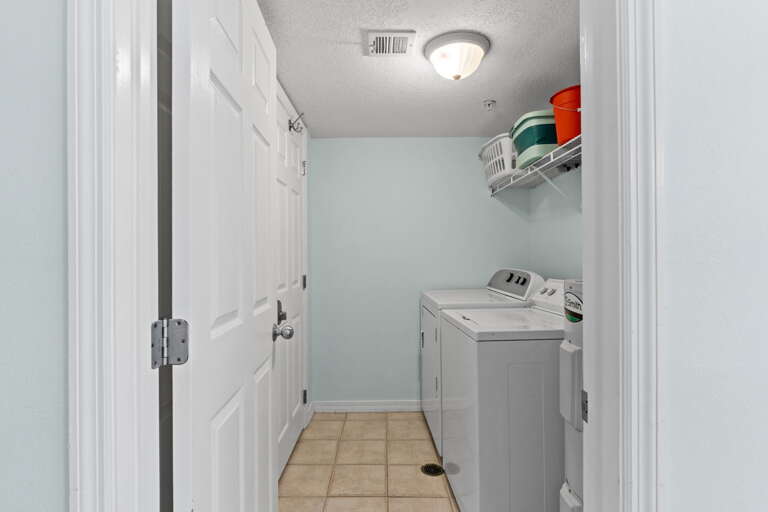 Laundry area has a full size washer and dryer.