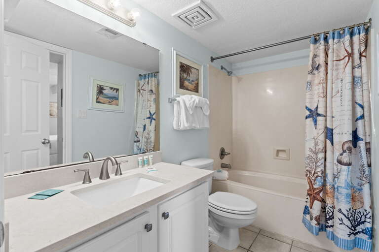 Guest bathroom with nautical themes that run throughout the entire unit.