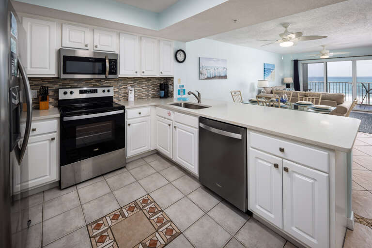Enjoy cooking in this fully stocked kitchen while enjoying the view