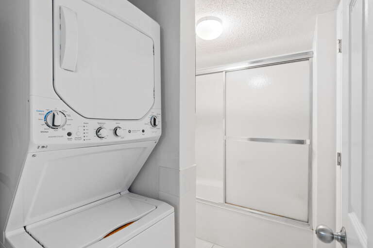 Washer & dryer area, as well as a tub & shower combo. 