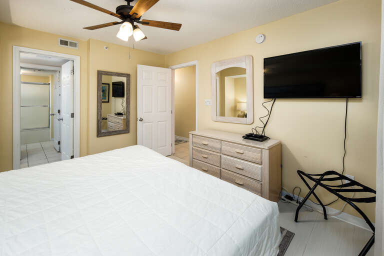 Additional views of the master bedroom featuring a nicely sized flat screen for all of your entertainment needs.