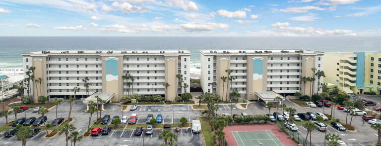 This beautiful resort has two buildings right on the beach!  Plenty of parking, pools & a tennis court are just a few perks when you stay here. 