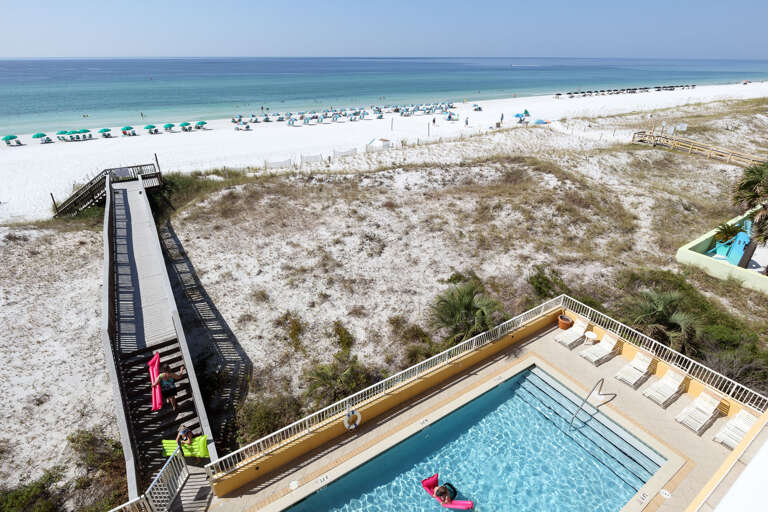 Also view of the direct access from the building over the sand dunes right to the shore.
