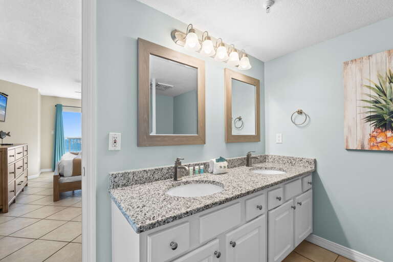 Double Sinks and long mirror are perfect for this delightfully furnished Master Bath.