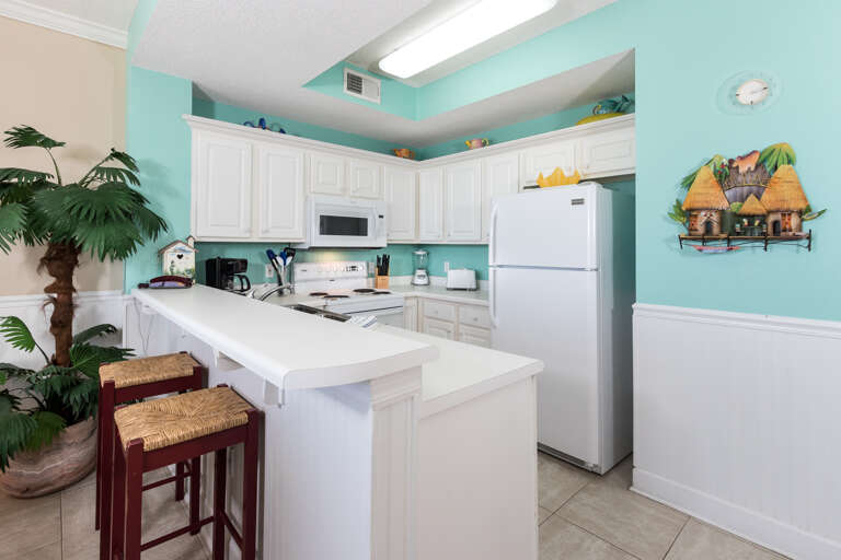 The kitchen comes fully equipped with a microwave, dishwasher, blender, toaster, and coffee maker. The bar area is ideal extra seating for extra dinner guests.