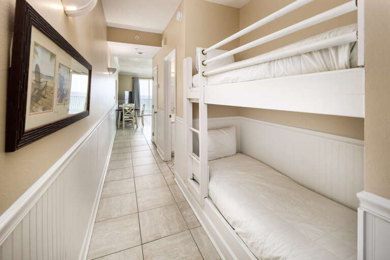 The bunk alcove contains a twin-sized bunk bed set.